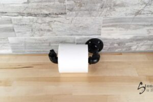 iron pipe toilet paper holder in matte black or natural galvanized